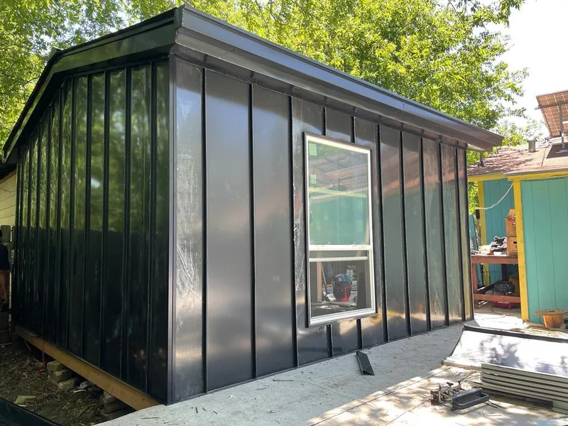 Black standing seam metal wall panels for Roof Inspection in University City