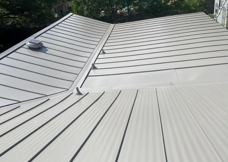 Solar attic fan installed on a metal roof for Roof Ventilation in University City
